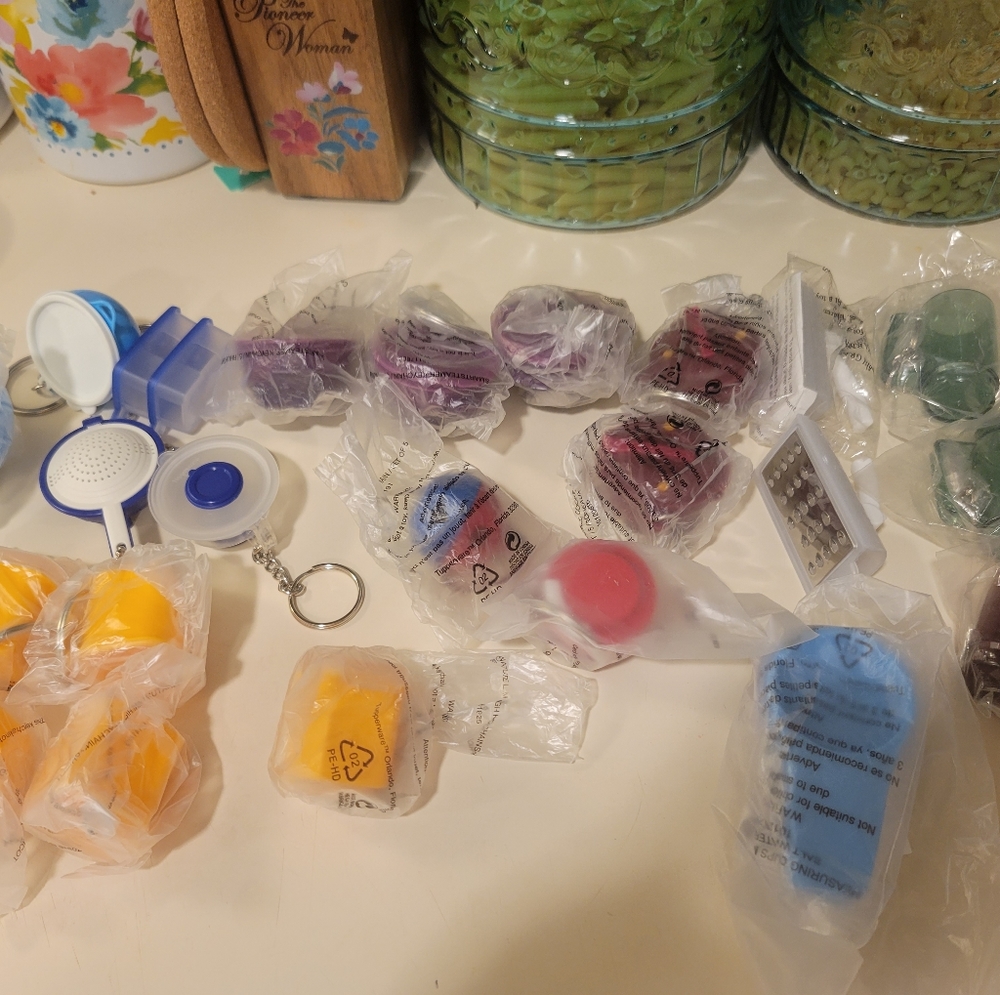 Tupperware key chains and 1 magnet
